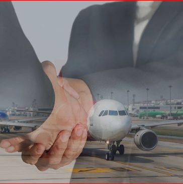 Business handshake superimposed on an airport runway with airplanes.