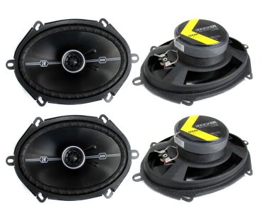 Two pairs of oval black speakers with yellow label on back.