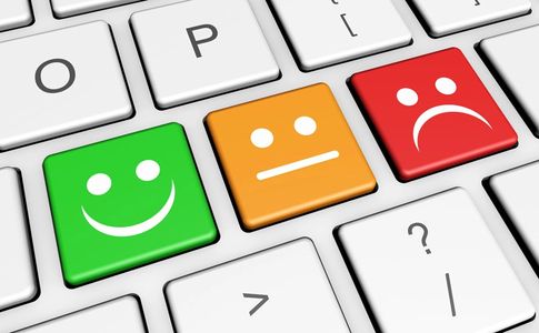 Keyboard with smiley, neutral, and sad face keys.