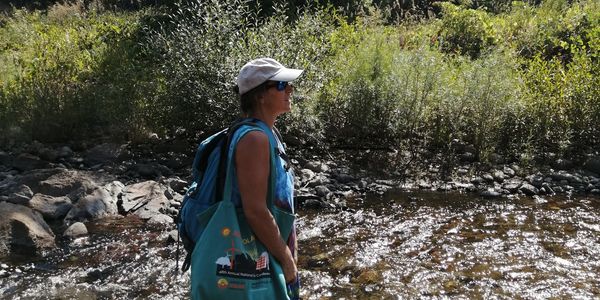 Image of woman walking in a river