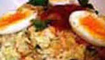 A close-up view of a dish featuring what looks like a potato or tuna salad