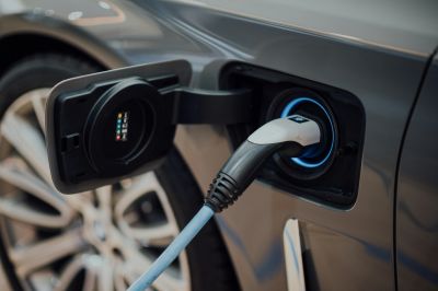 Electric car charging plug connected.