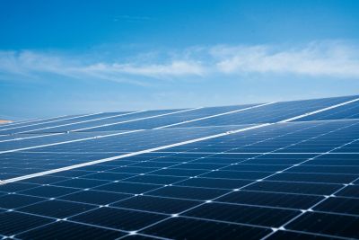 Solar panels under a clear blue sky.