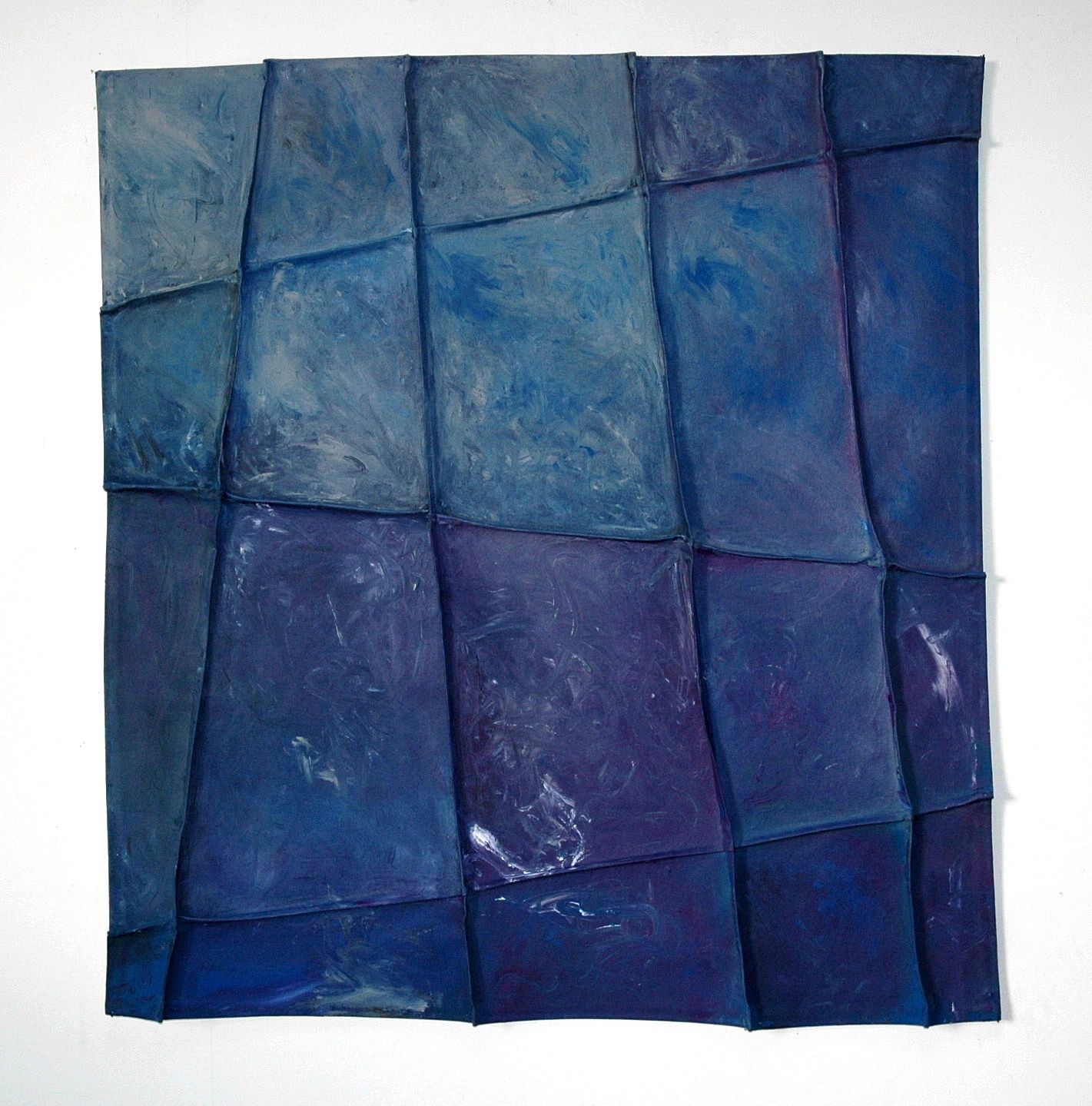 Abstract textured artwork with shades of blue and purple in a grid pattern.