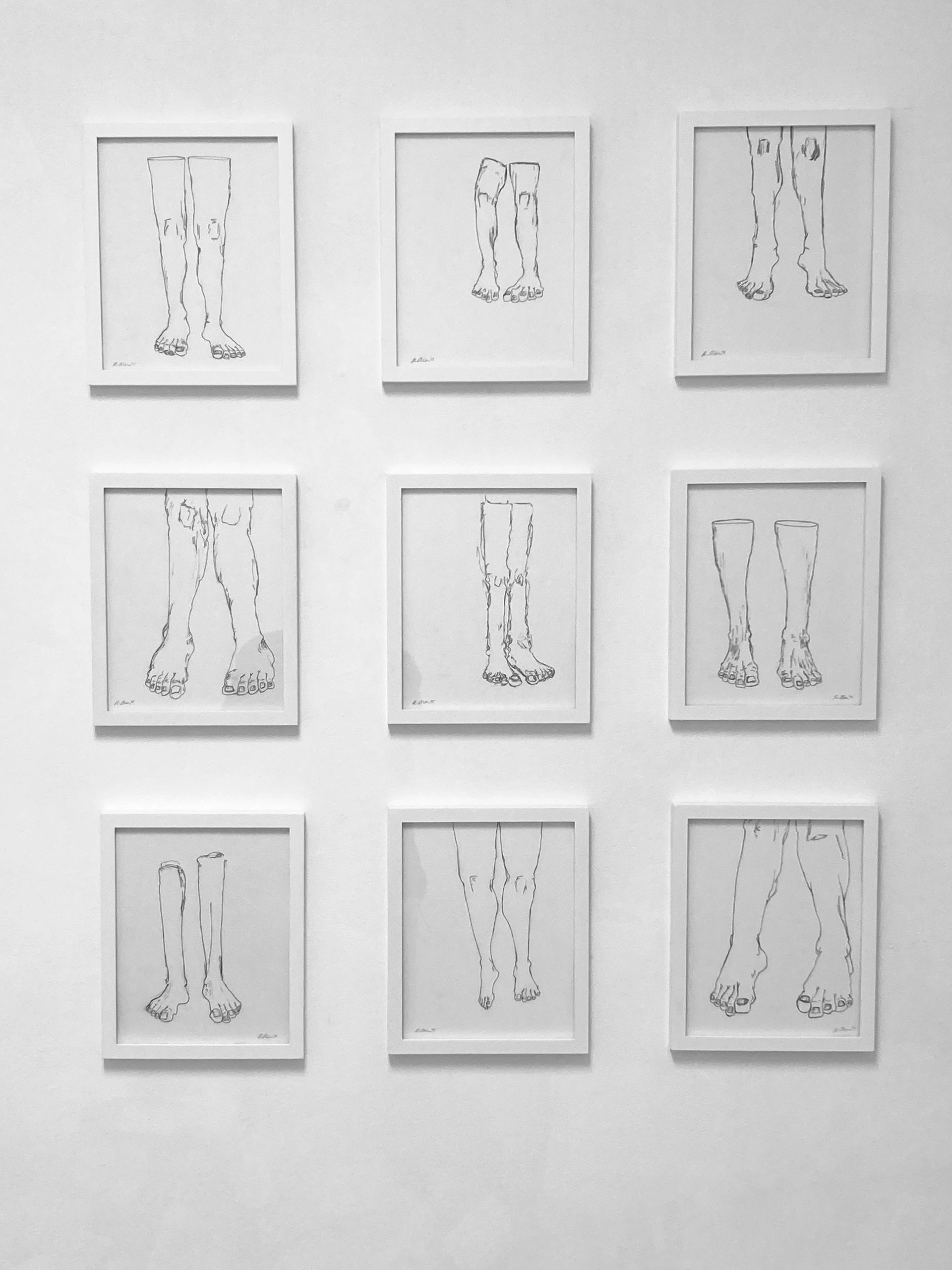 Nine framed minimalist sketches of legs and feet on a white wall.
