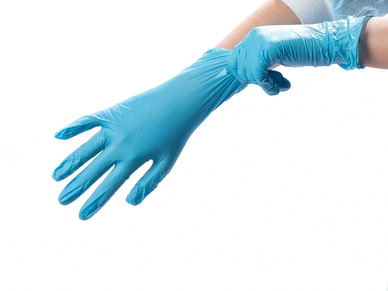 Person putting on blue disposable glove.
