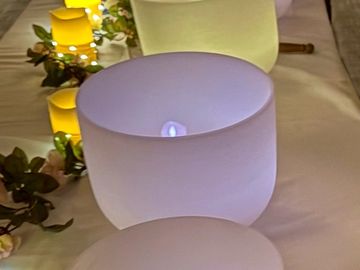 Frosted glass candle with LED light.