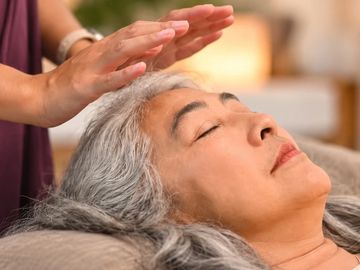 Person receiving a relaxing energy healing treatment.