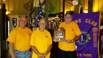 Lion Jerry Moore receives award for Golf Tournament fund raiser.