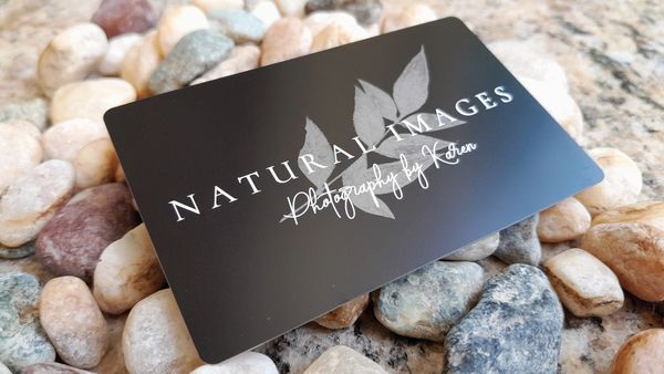 Black anodized aluminum card engraved in white