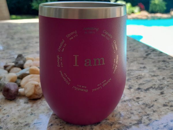 Magenta tumbler engraved.  Powder coat removed showing stainless background