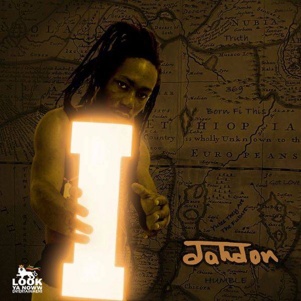 Man with dreadlocks holding a glowing letter I in front of an old map.