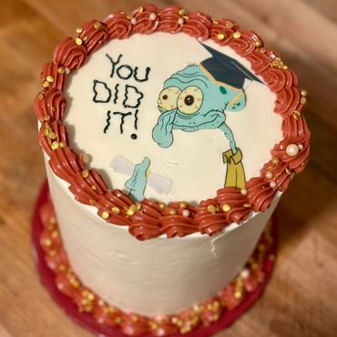 Squidward-themed graduation cake with fun details—perfect for fans and unique celebration vibes!