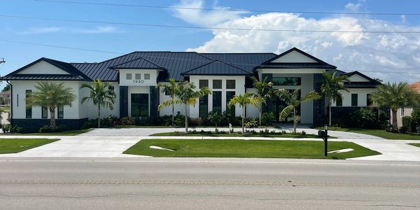 4,600 square foot ultra-luxury spec home with a 9-car garage and 14' overhead doors.