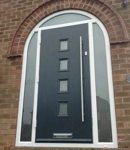 Arched frame composite door fitted in Mansfield Woodhouse in Anthracite Grey with a Long Bar handle.