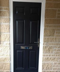 Certified FD30 Composite Fire Door fitted in black with chrome hardware.