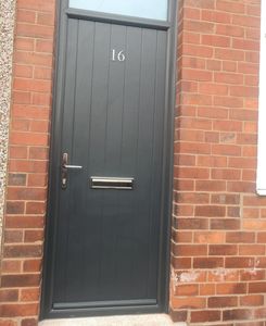 Narrow Anthracite Grey Composite front door with matching grey frame and a toplight.