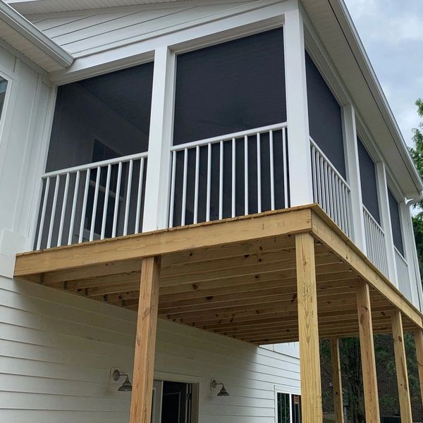 2nd story aluminum screened porch with aluminum spindles