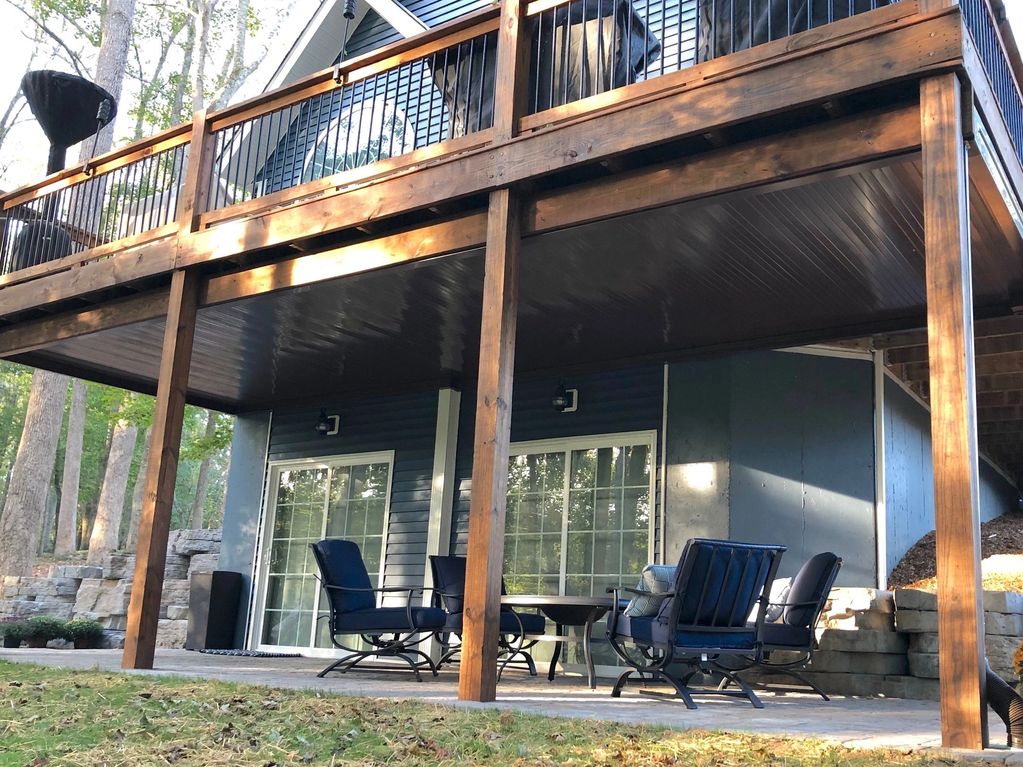 Bronze color aluminum flat pan patio cover under a deck