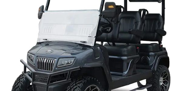 Four-seater black golf cart with rugged tires and roof.
