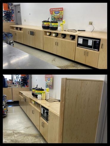 Wooden kitchenette area with microwave and coffee supplies in a break room.