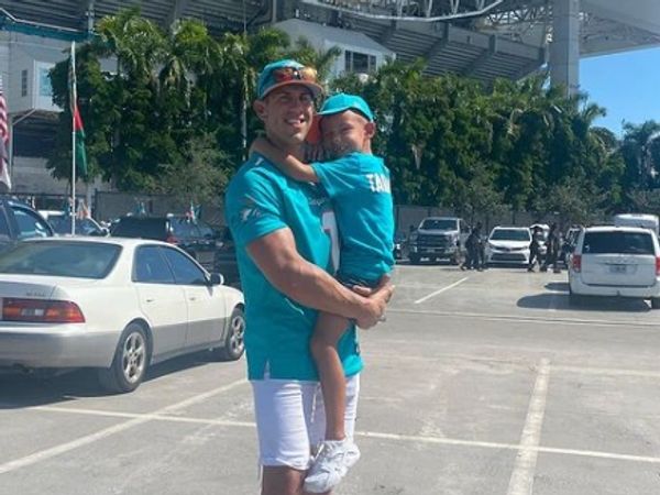 Owner, Jarrett Solimando, with his son in front of Hard Rock Stadium before a Miami Hurricanes game