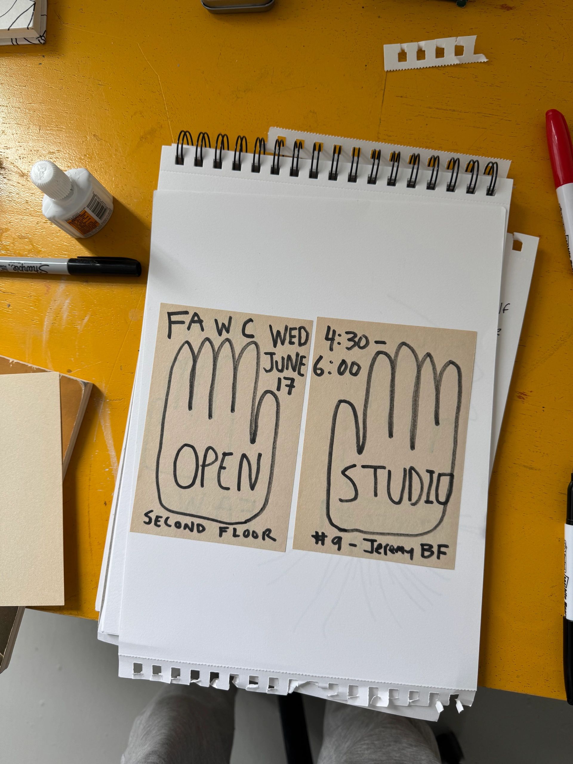 Hand-drawn signs on paper for an open studio event on June 17.