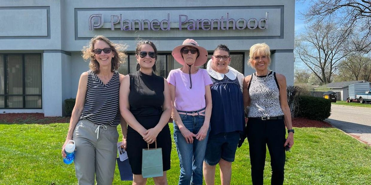 Voices for Life volunteers standing outside Planned Parenthood