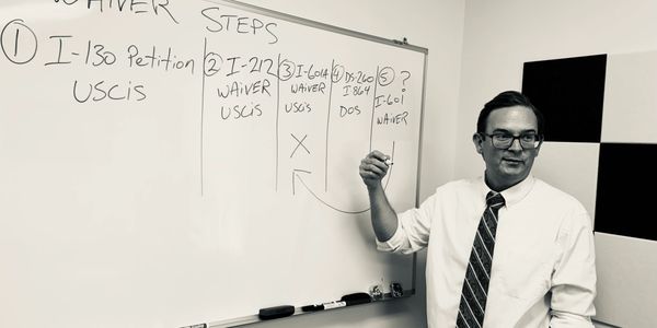 Attorney Christopher Chaney conducts an immigration legal consultation at his office in Durham, NC.