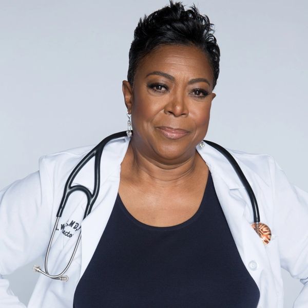 Dr. Vickie in a white coat and blue shirt