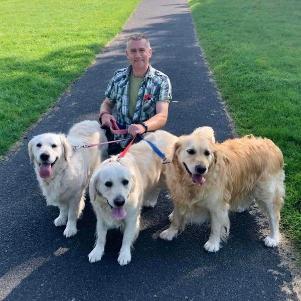 Allan Beneke experienced dog walker and pet chaperone accompanied by three dogs