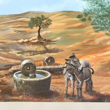 Two donkeys with ancient olive oil press grinder in Palestine. by Jill Roberts wine country Temecula 