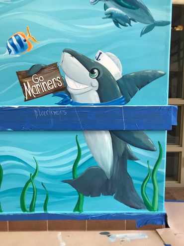Painted dolphin on wall mural in elementary school in Menifee, CA. angel fish, go Mariners