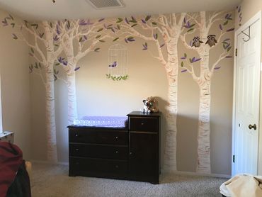 White birch trees with purple and green leaves, bird cage in baby nursery room. Canyon Lake CA