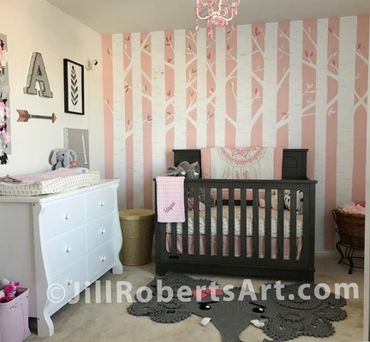 Baby nursery painted wall mural. White trees with pink background and leaves. Brown crib; Elephant