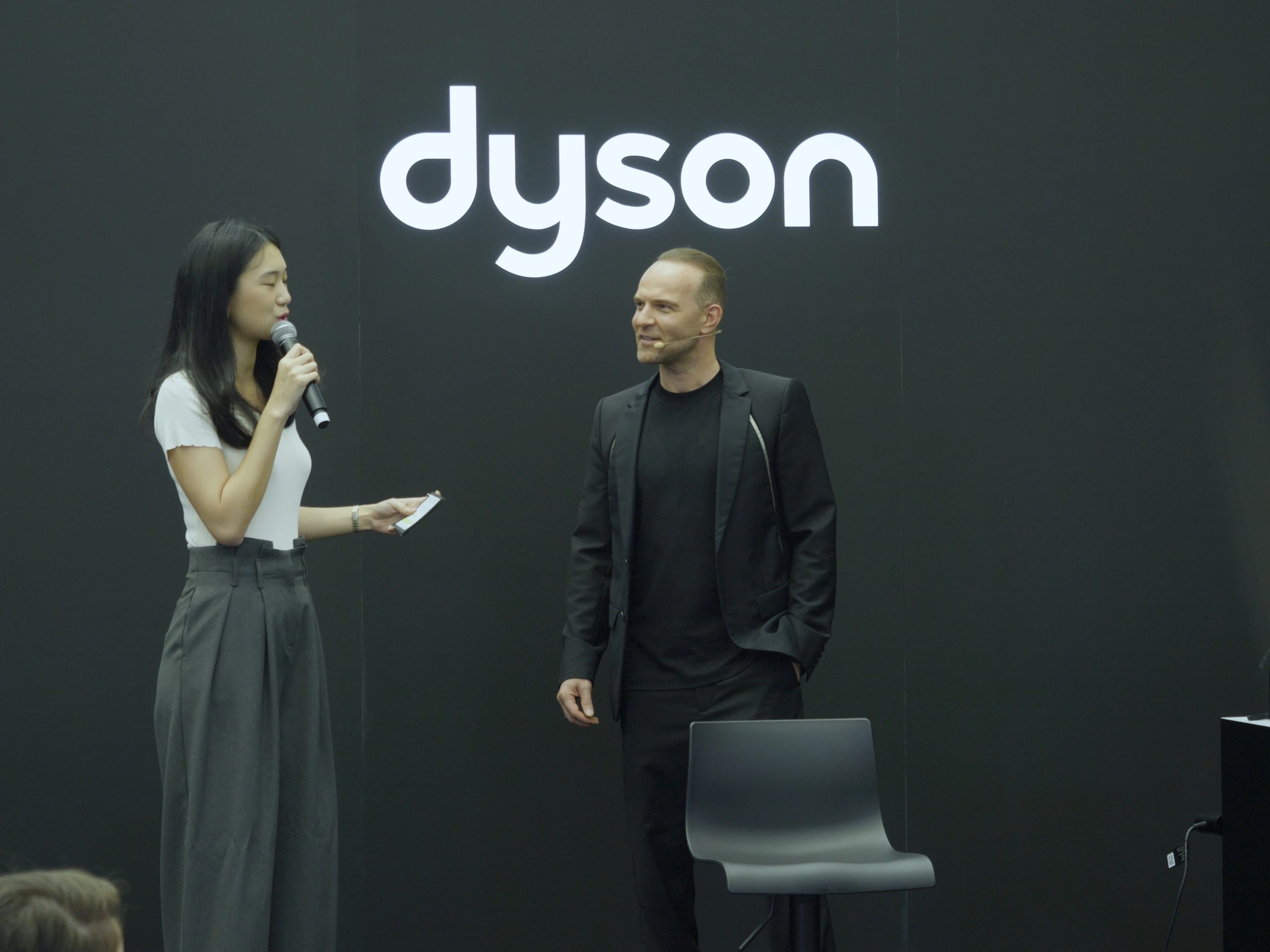 Yann Beyrie listening to a lady at Dyson Masterclass