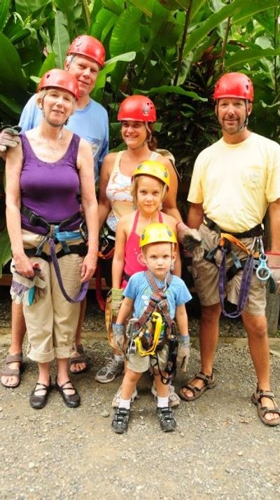 Multigenerational family dressed for ziplining in Manuel Antonia, Costa Rica.