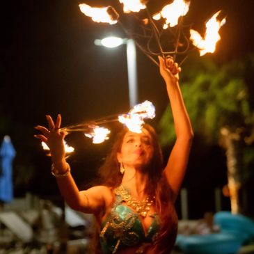 Bellydancer twirling a fire fan.