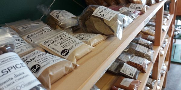 Shelves displaying various packaged spices and herbs.