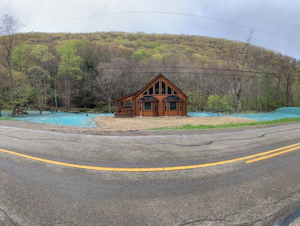 Hydro Seeding done next to a cabin with multiple acres.