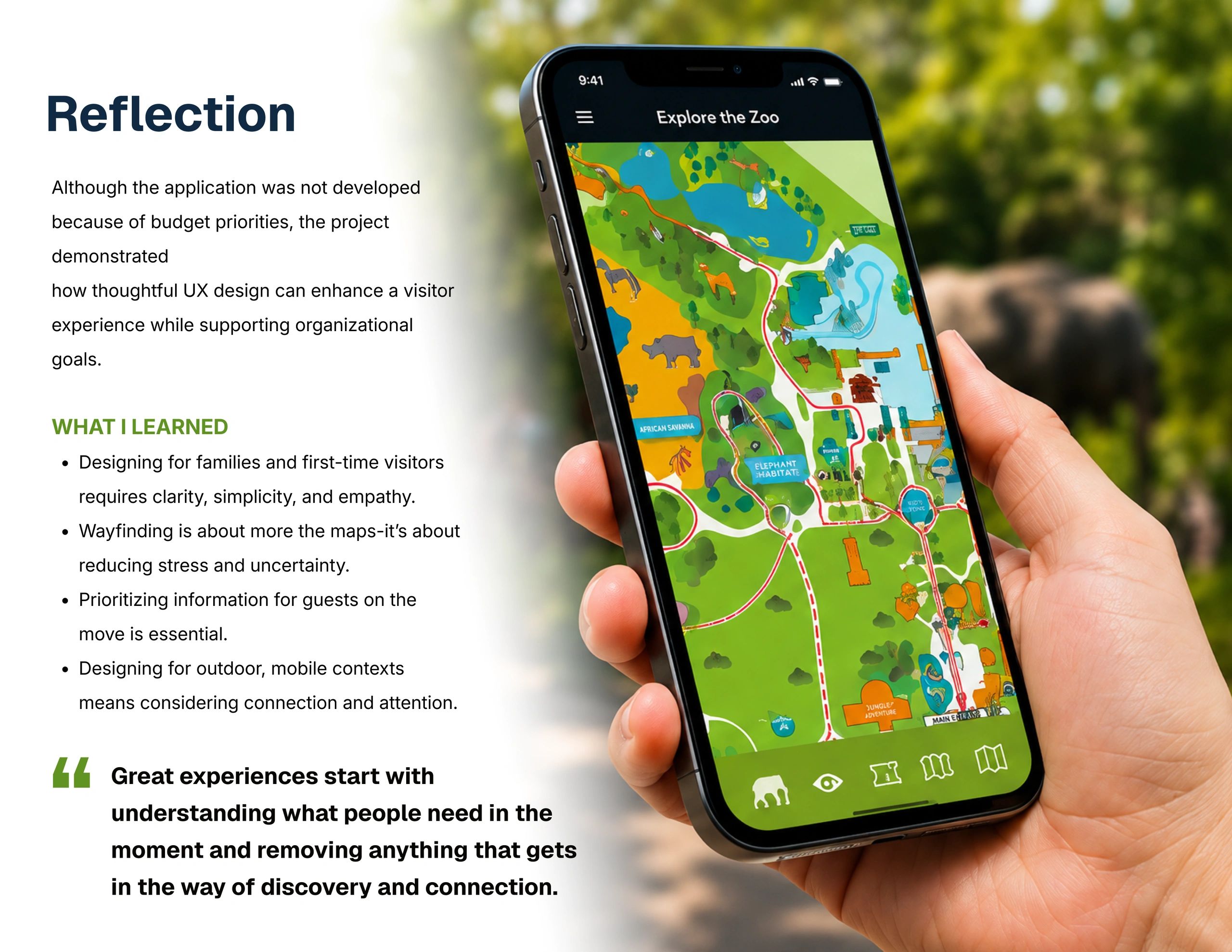 Person holding a smartphone displaying a colorful zoo map app.
