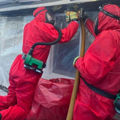 an image of a team removing asbestos