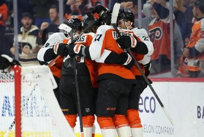 The Flyers celebrate a goal against the Penguins.