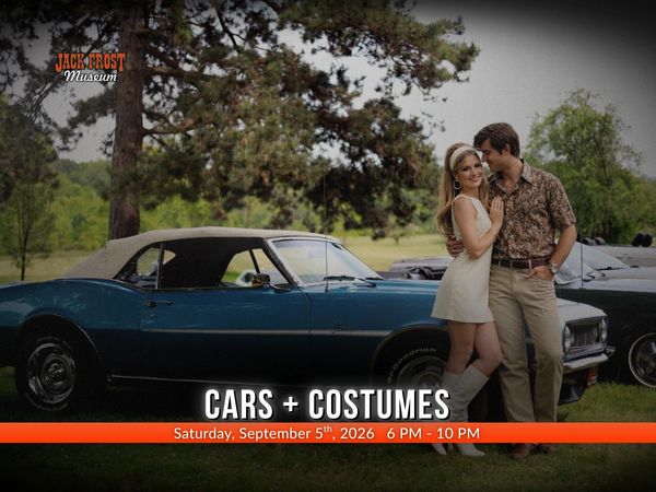 A classic blue Camaro with a couple dressed in the late 1960s costumes, a Jack Frost Museum logo and