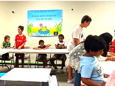 Children participating in a kids ministry activity indoors.