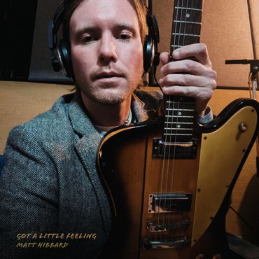 Matt Hibbard in studio, blending music with visual art.