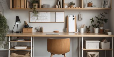 A home office with a desk, chair and organised shelves