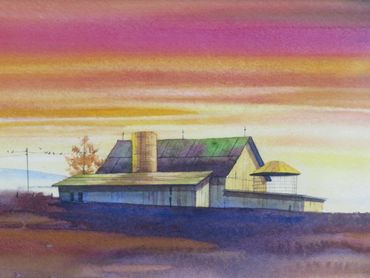 Watercolor painting of a barn at sunset with vibrant sky colors.