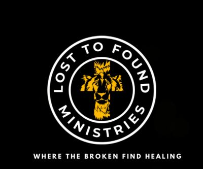 Logo of Lost To Found Ministries with a lion and cross symbol.
