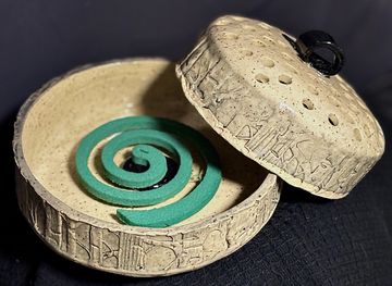 Handbuilt pottery mosquito coil burner. Could also be used as an incense burner. 